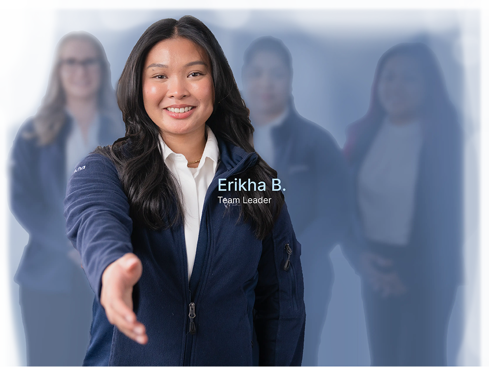 Erikha B., Team Leader at MD Agility, extending a welcoming handshake with her team behind her